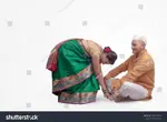 stock-photo-hindu-female-touching-his-feet-with-all-due-respect-with-hands-showi.jpg