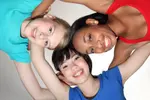 happy-group-huddle-mixed-race-student-girls-21459930.jpg