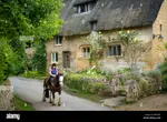 girl-on-horseback-below-thatched-roof-cottage-stanton-the-cotswolds-gloucestersh.jpg girl-on-horseback-below-thatched-roof-cottage-stanton-the-cotswolds-gloucestersh.jpg